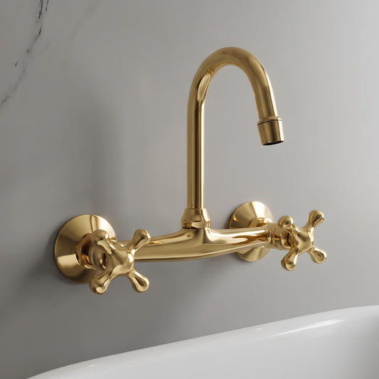 Front view of a solid brass wall mounted bathroom faucet in unlacquered brass finish