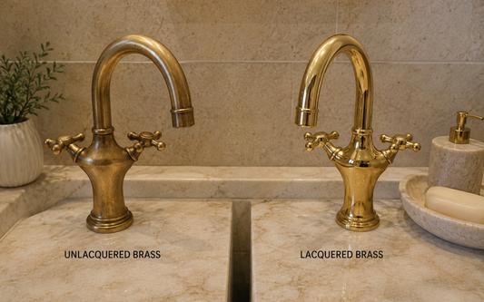 Unlacquered brass and lacquered brass bathroom faucets compared side by side in a luxury bathroom.