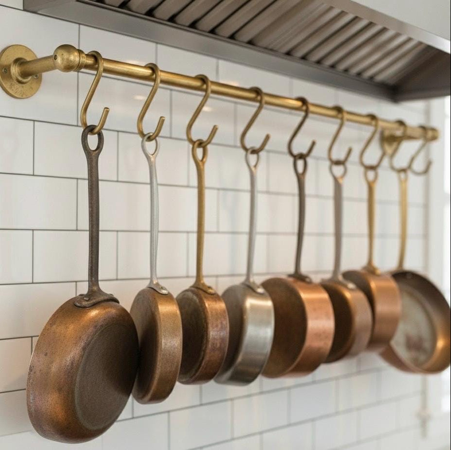 Angled view of solid brass pot rail with hooks