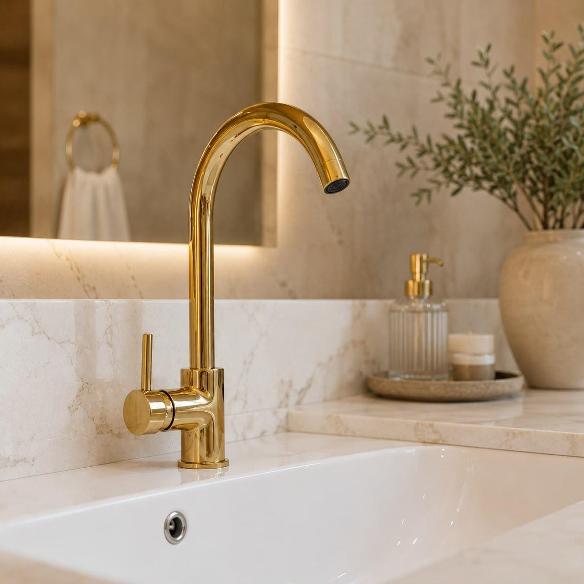 Angled view of unlacquered brass single hole faucet