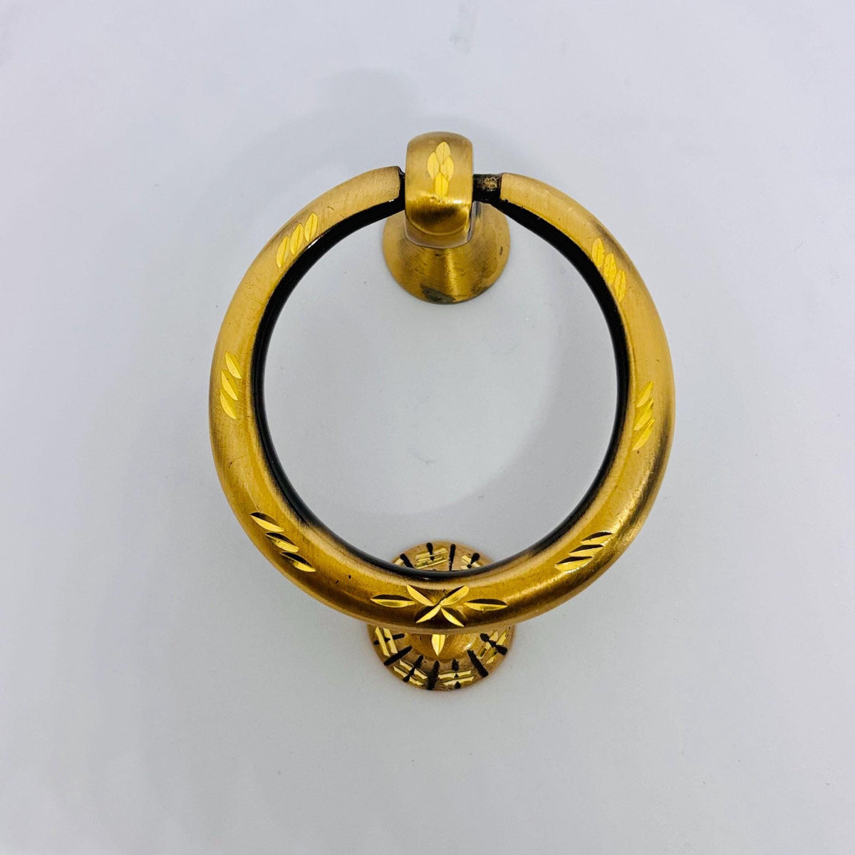 Antique brass front door knocker with engraved detailing