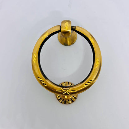 Antique brass front door knocker with engraved detailing