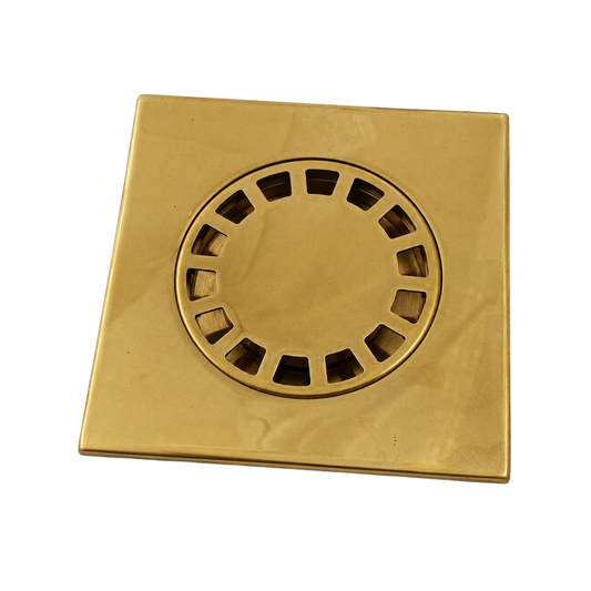 Antique unlacquered brass square floor drain cover for a luxury shower