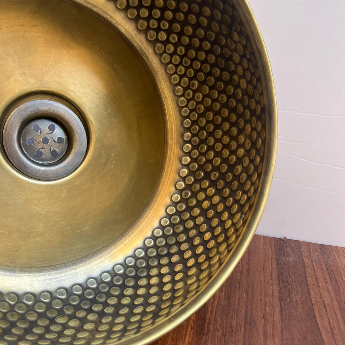 Artisan handcrafted brass vessel sink for a bathroom vanity