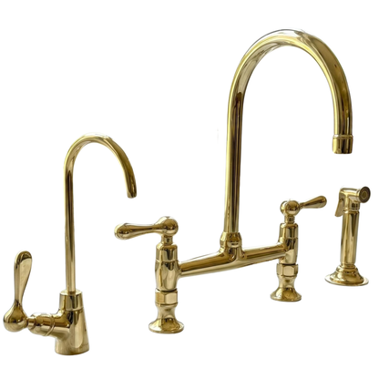 Bridge kitchen faucet with dedicated drinking water tap in unlacquered brass