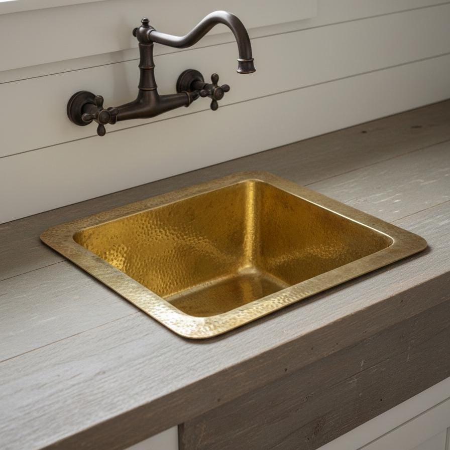 Compact unlacquered brass kitchen sink for prep areas