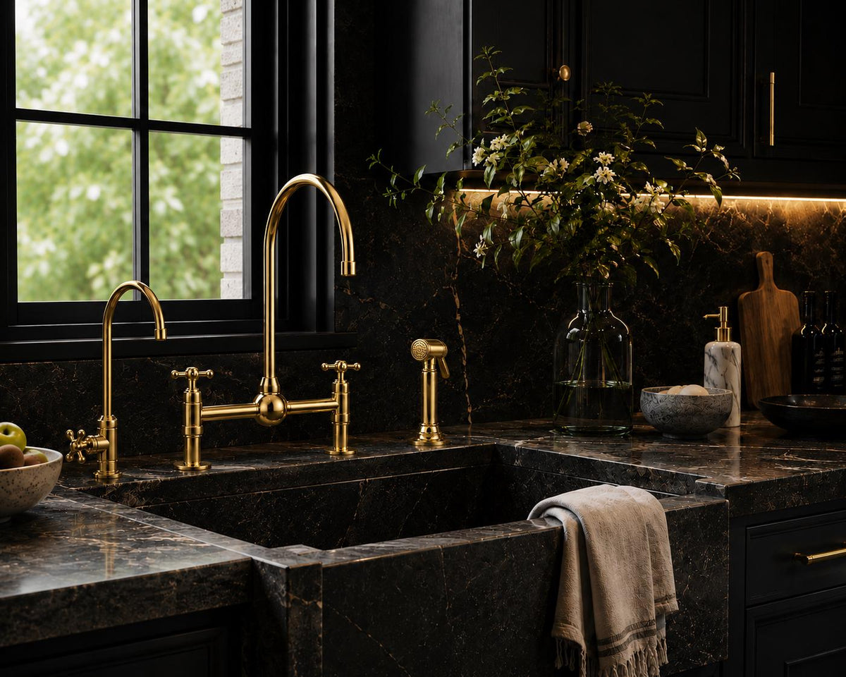Dual cross handles on unlacquered brass bridge kitchen faucet