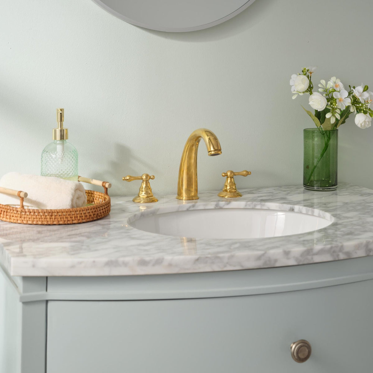 Elegant solid brass bathroom faucet with a natural living brass finish