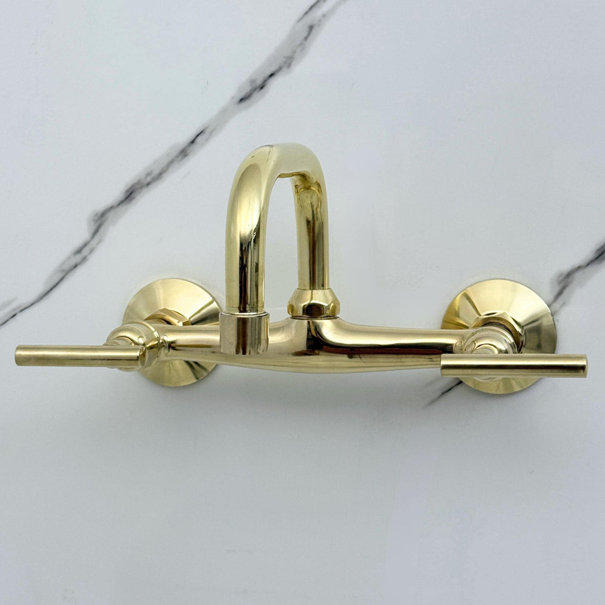 Elegant wall mounted bathroom faucet installed above a vanity sink