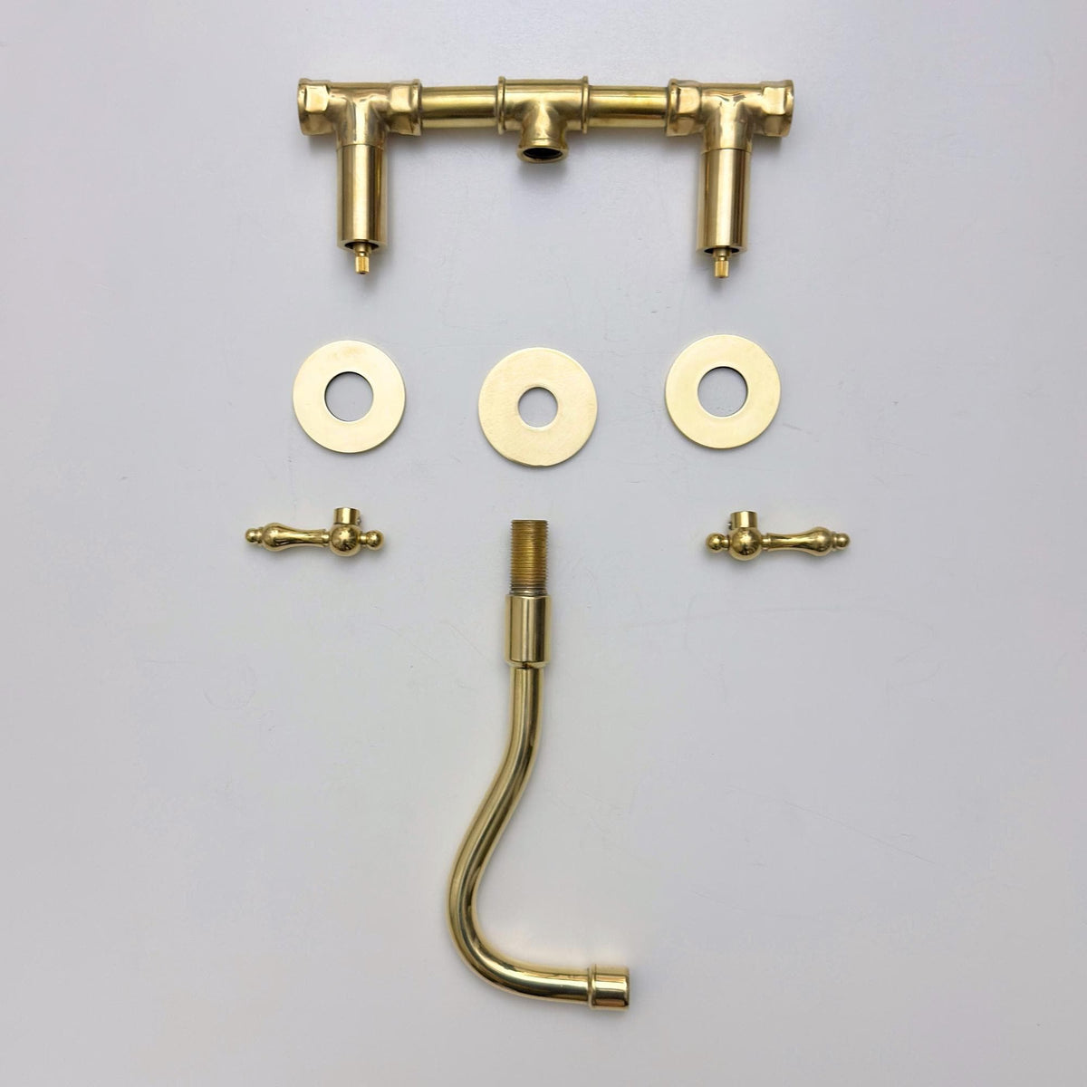 Elegant wall mounted bathroom faucet with living brass finish