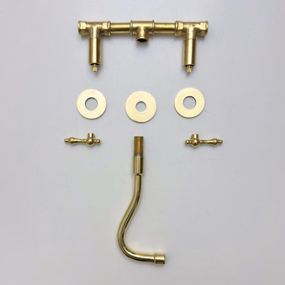 Elegant wall mounted bathroom faucet with living brass finish