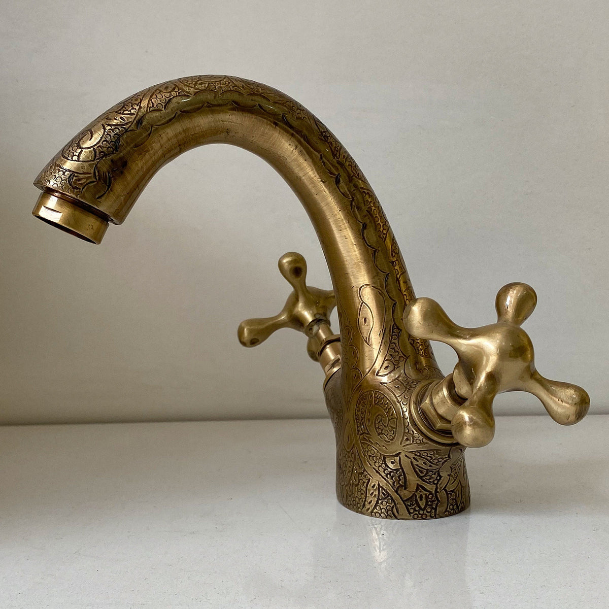 Front view of the oil rubbed bronze single hole bathroom faucet with cross handles