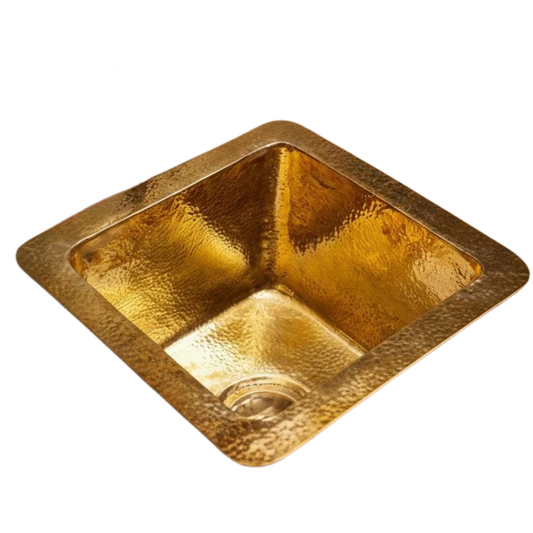 Hammered single bowl brass kitchen sink in unlacquered brass