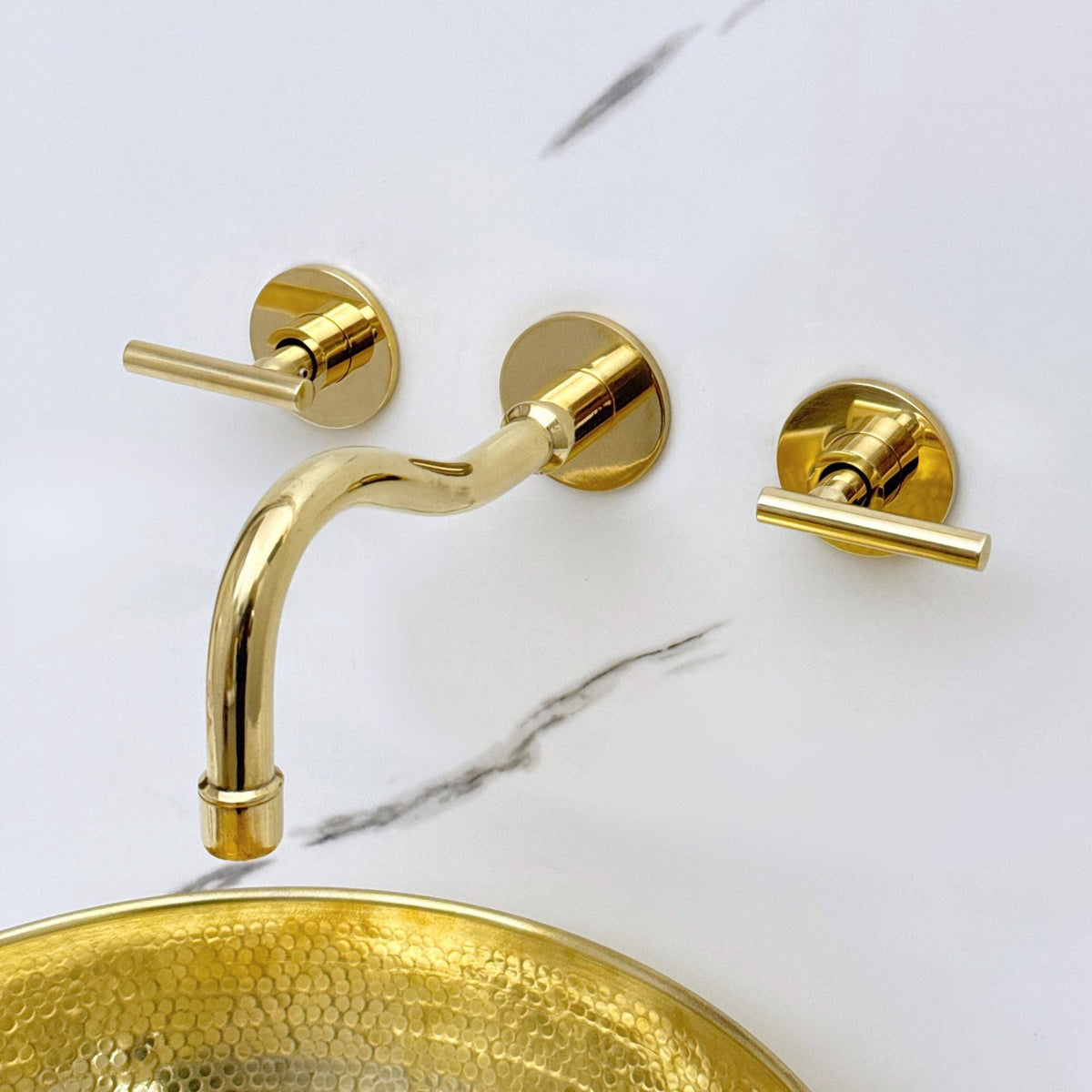 Handcrafted unlacquered brass faucet for luxury bathroom vanity