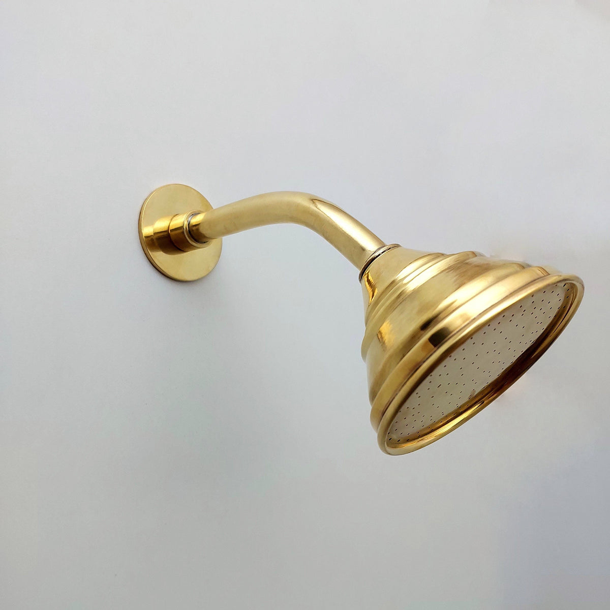 Living brass shower fixture for a luxury bathroom