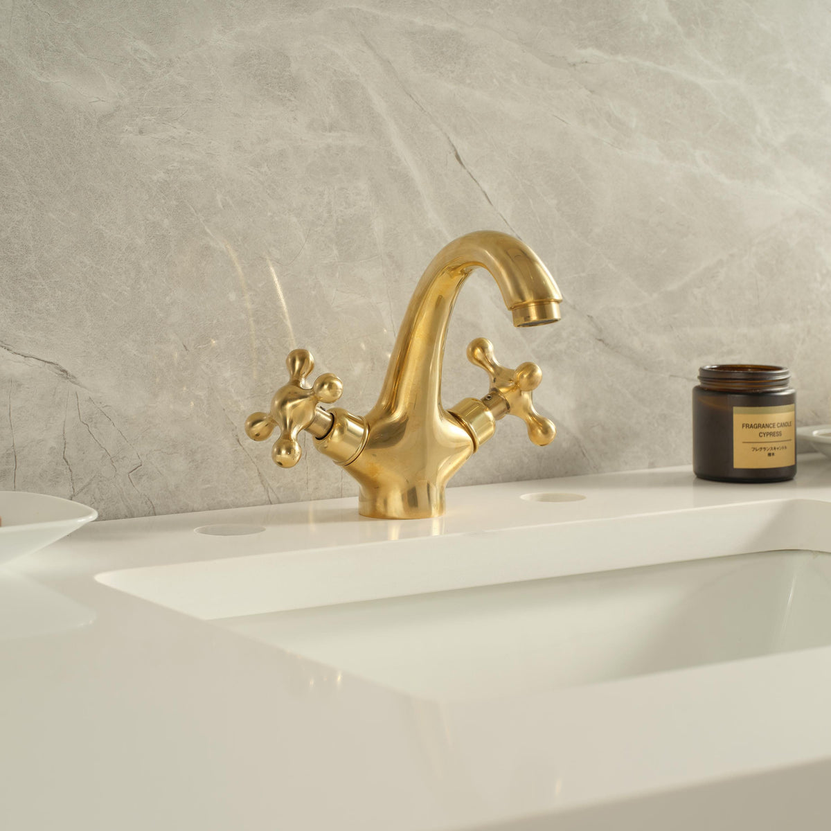 Luxury unlacquered brass widespread bathroom faucet installed on a bathroom vanity