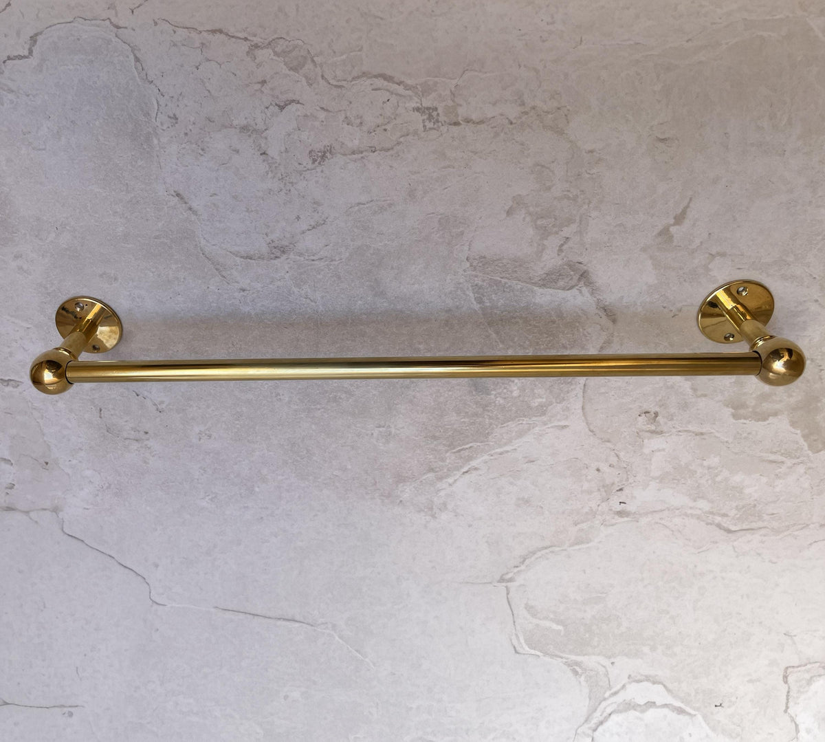 Luxury vintage brass towel rail for a traditional bathroom