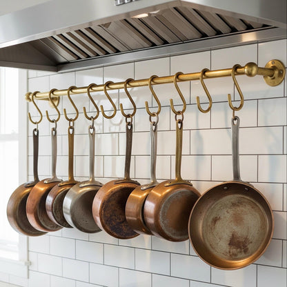 Matching brass S hooks on wall mount pot rail