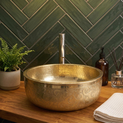 Moroccan handcrafted round brass sink with decorative leaf patterns