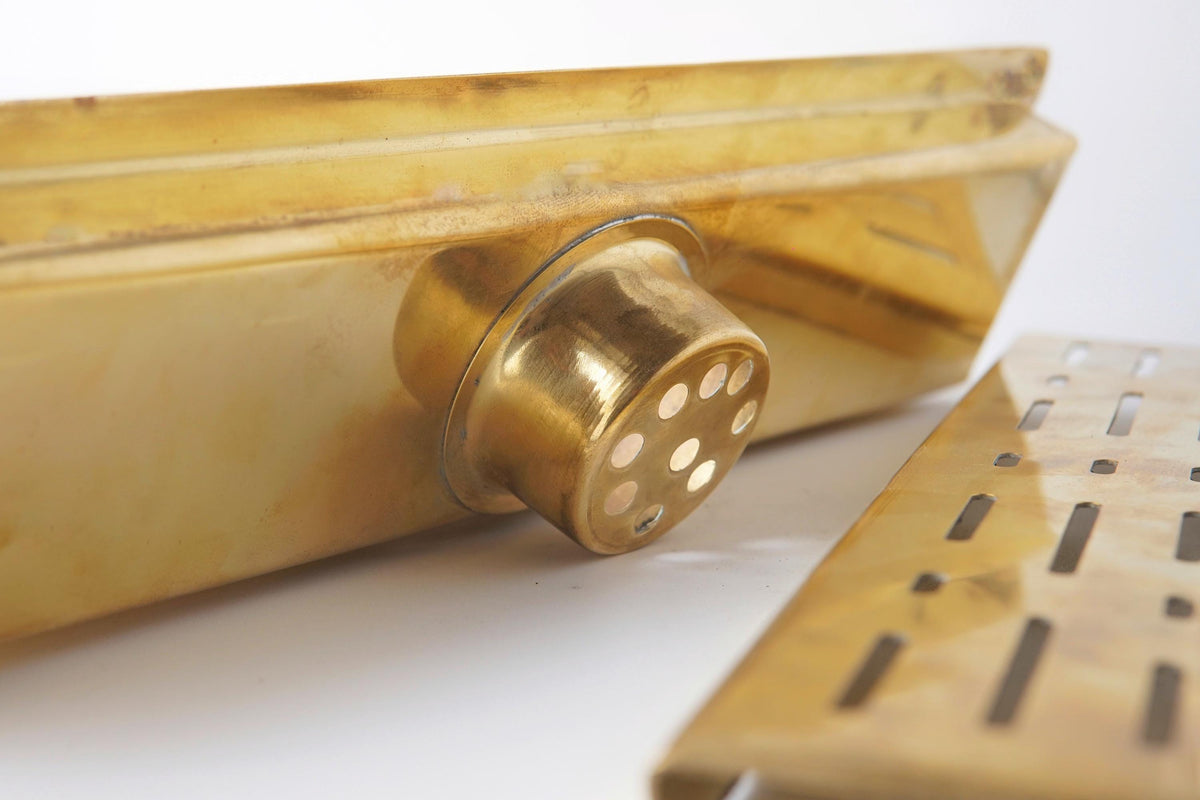 Premium brass linear drain with a removable grate