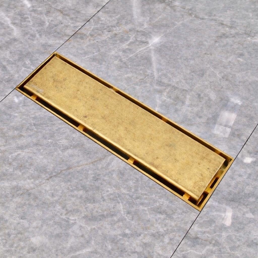 Reversible brass shower drain cover for visible or concealed installation