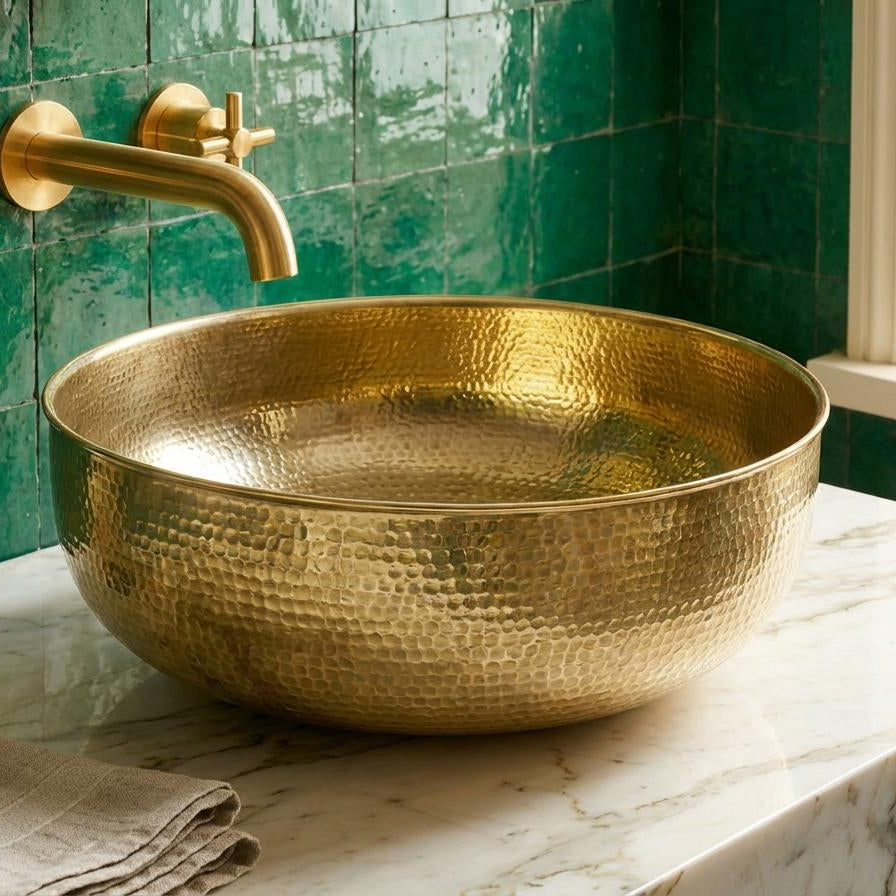 Round solid brass vessel sink with a hand-hammered finish