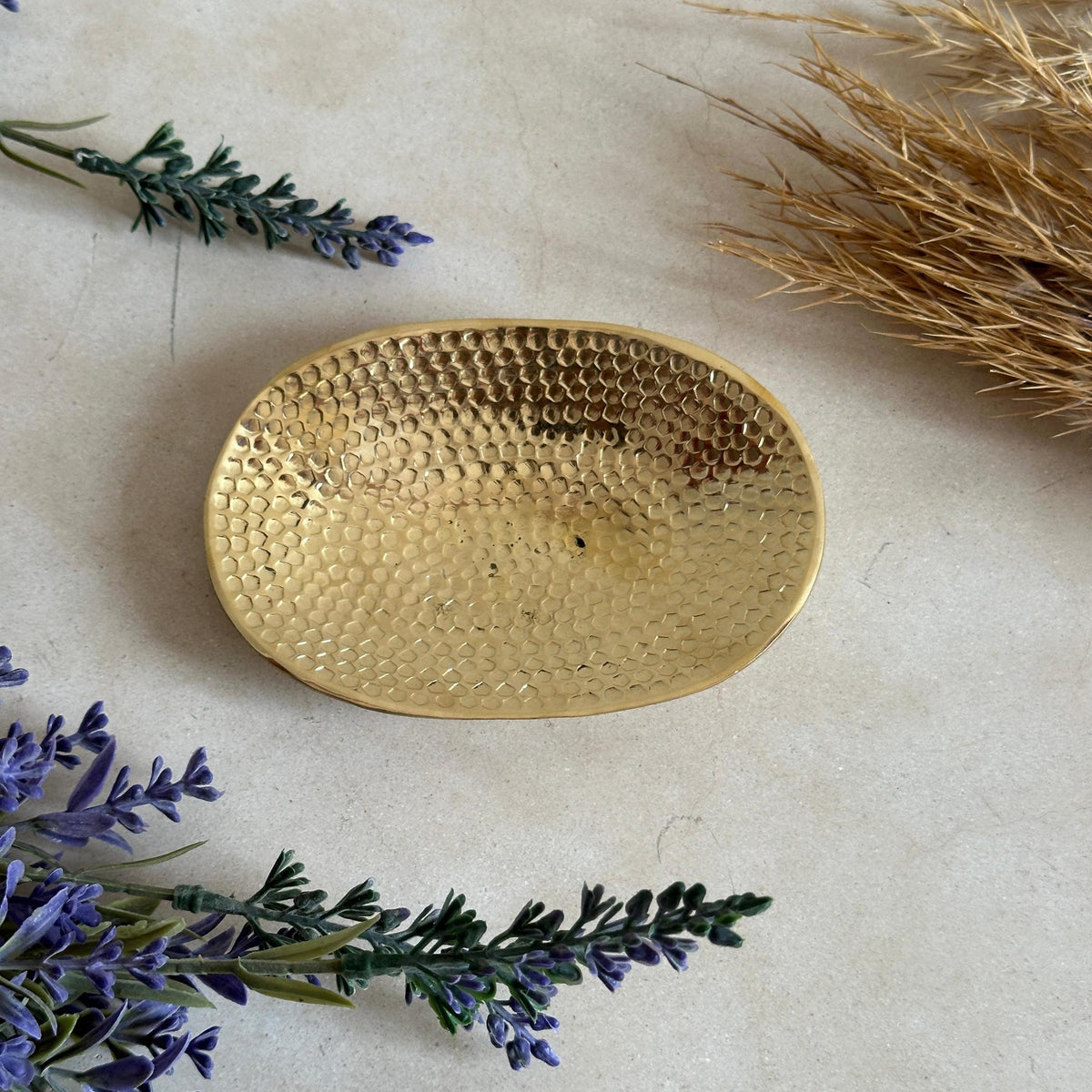 Rustic solid brass soap holder with a textured hammered finish