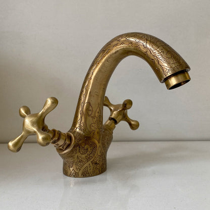 Side angle of the handcrafted oil rubbed bronze bathroom faucet showing curved spout
