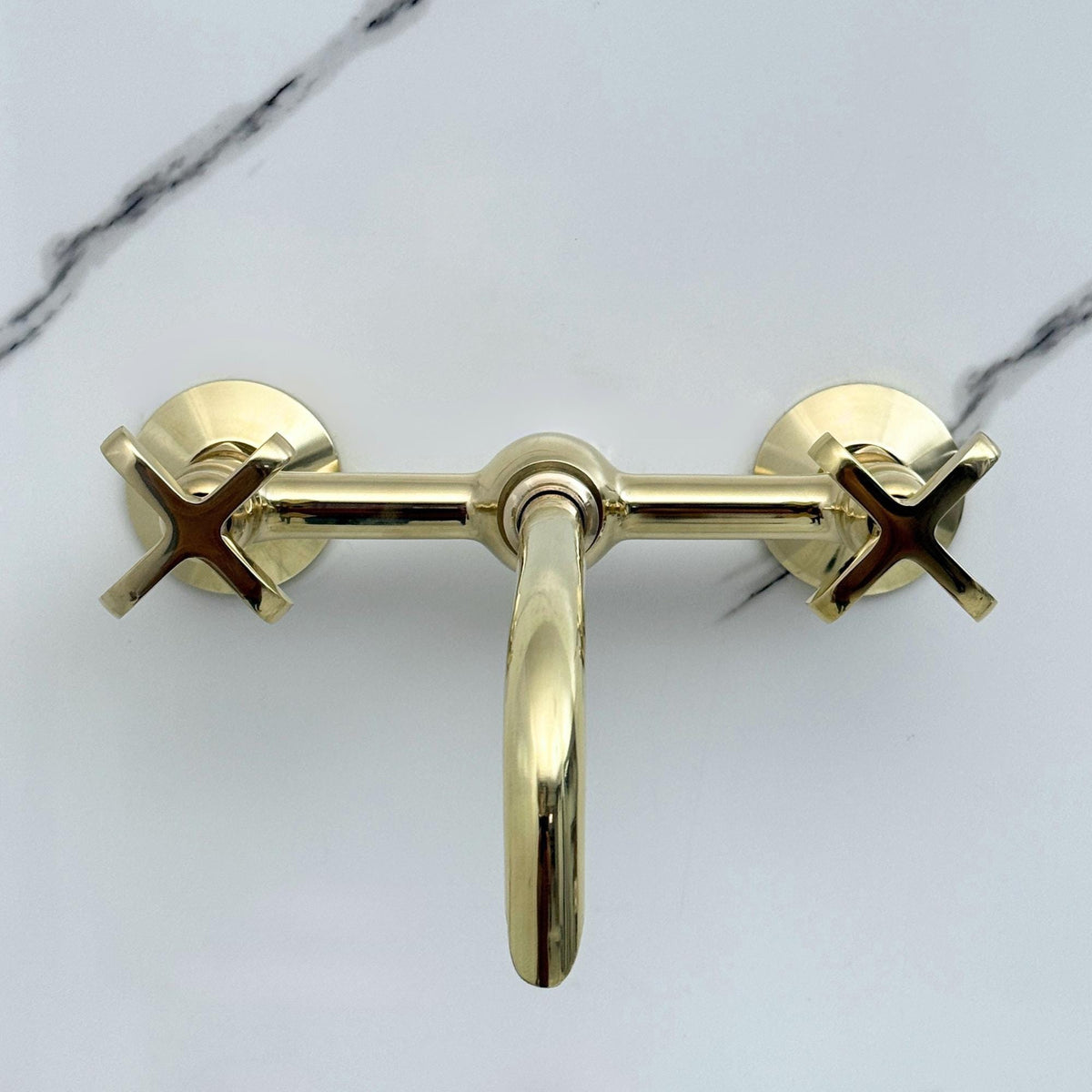 Smooth ball center detail on unlacquered brass faucet
