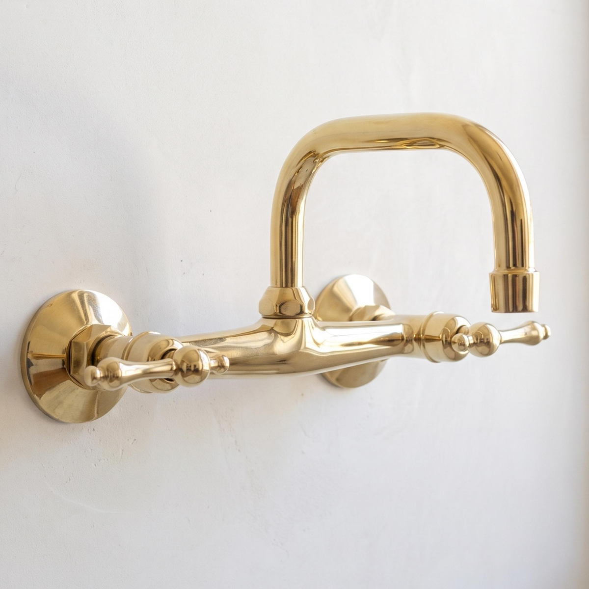 Solid brass wall mounted bathroom faucet with curved swivel spout