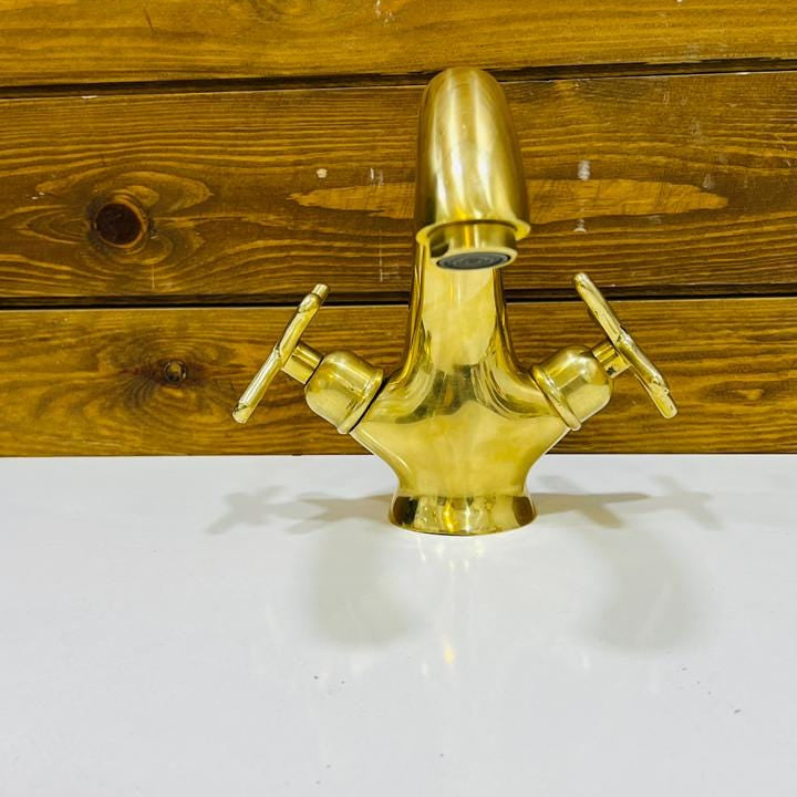 Top view of deck mounted unlacquered brass bathroom faucet for vanity sink