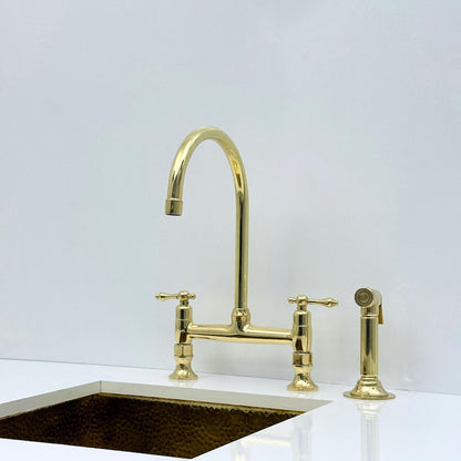 Unlacquered brass bridge faucet with living finish