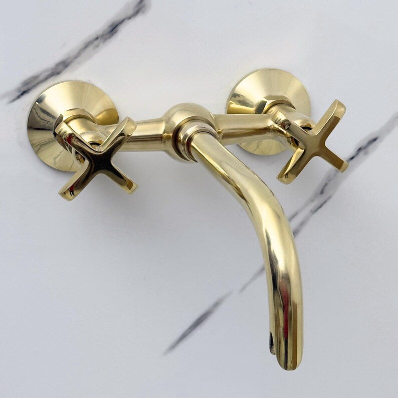 Unlacquered brass wall mount faucet in modern bathroom setting