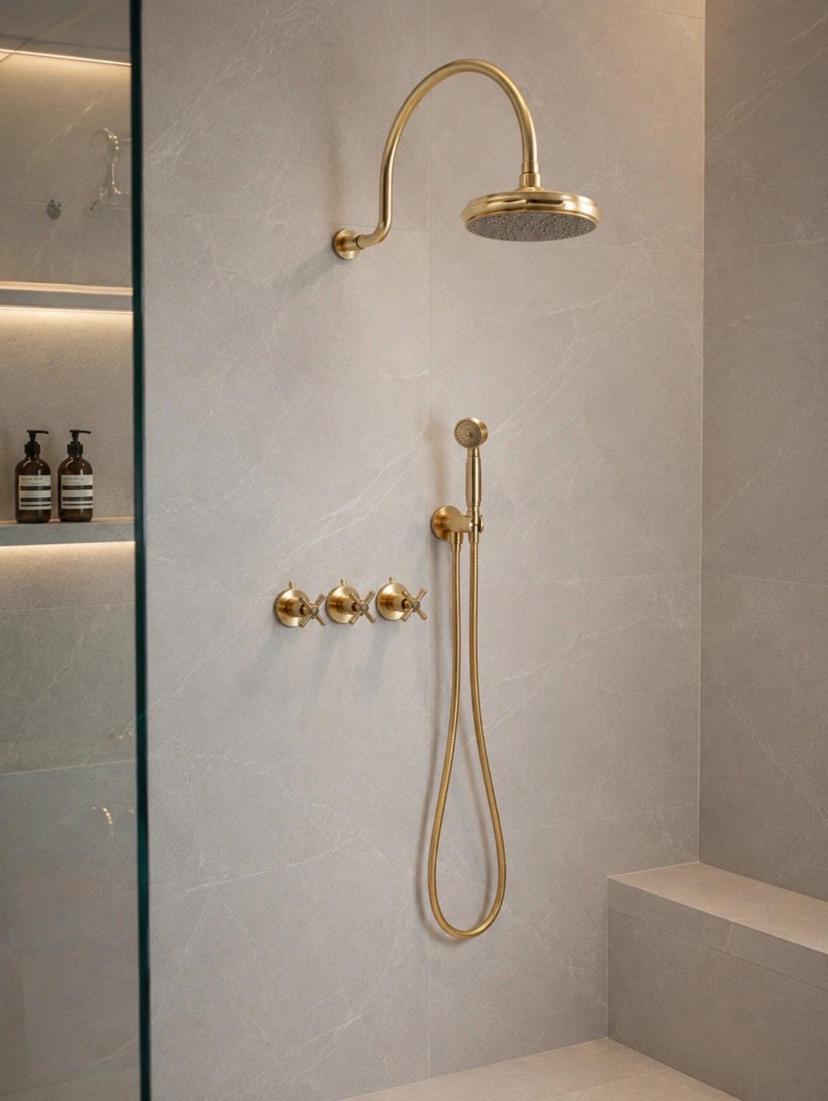Wall mounted brass shower system with a tub filler and handheld shower