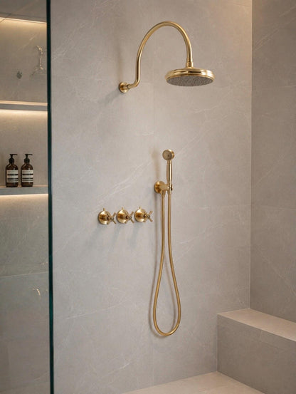 Wall mounted brass shower system with a tub filler and handheld shower