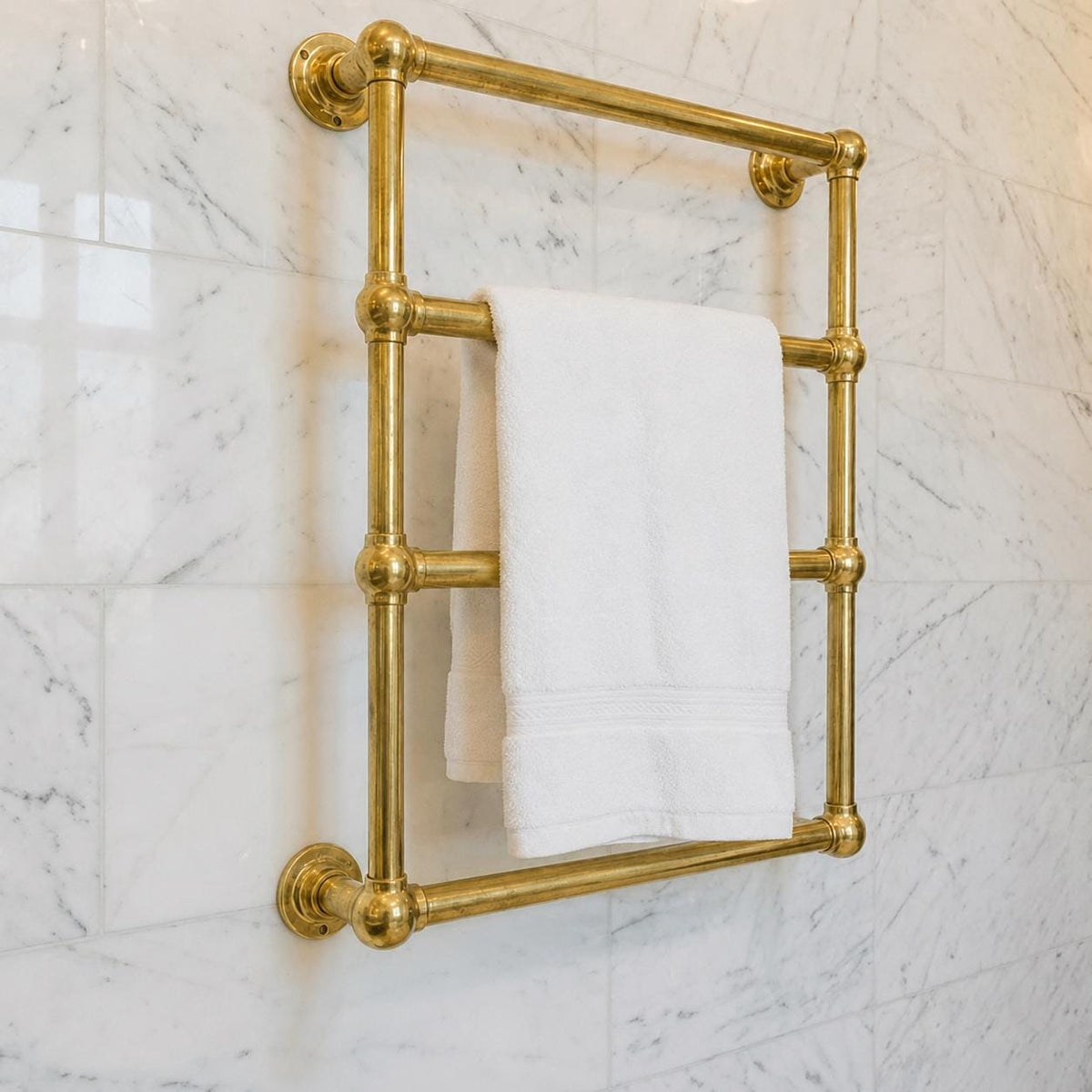 Wall mounted brass towel rail for a luxury bathroom