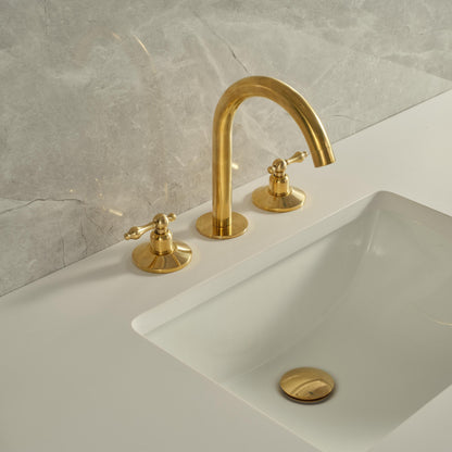 Angled view of unlacquered brass vanity sink faucet with gooseneck spout