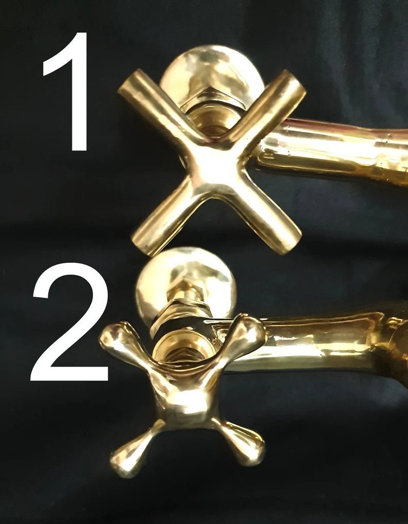 Handmade brass wall faucet in vintage bathroom setting